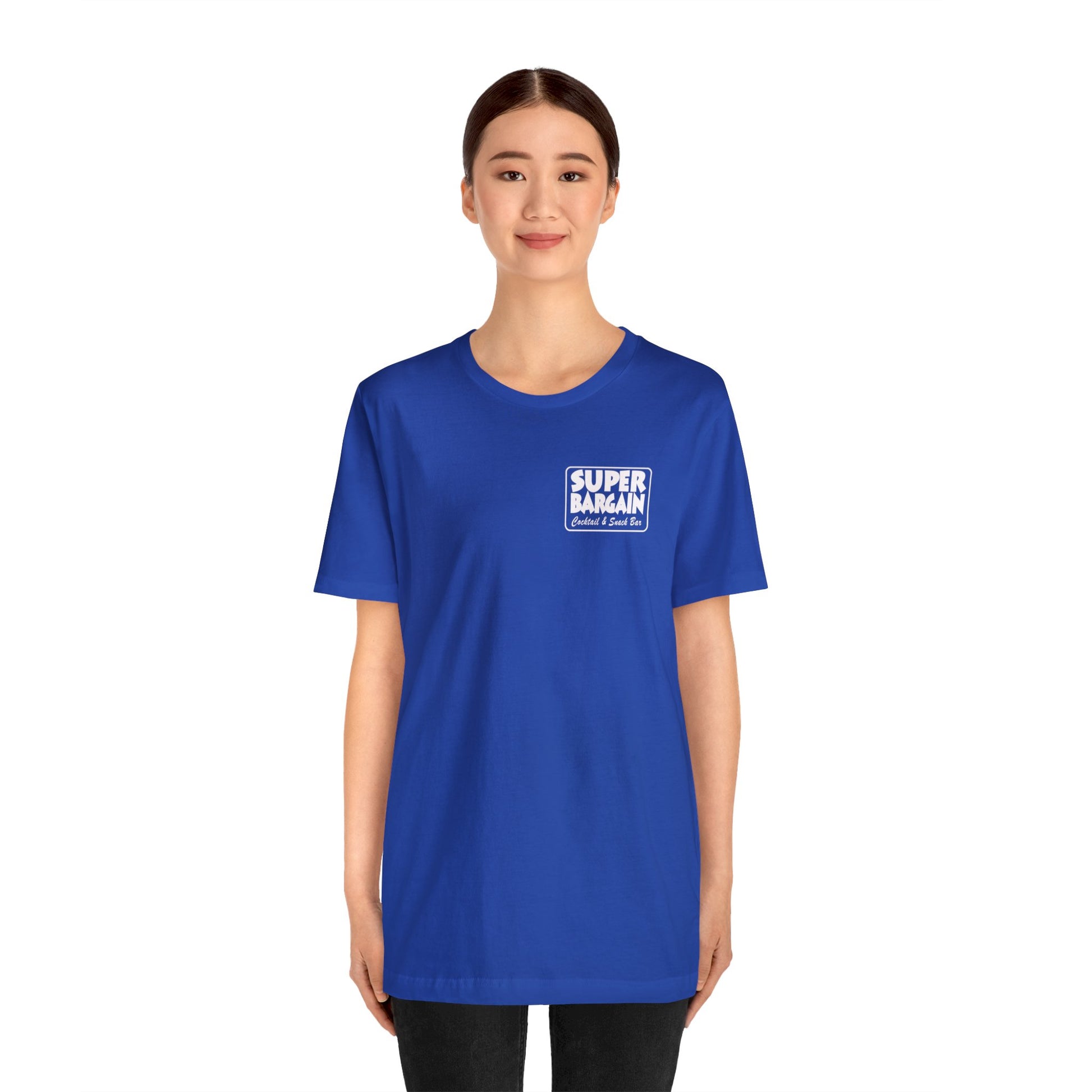 A young woman wearing a bright blue Unisex Jersey Short Sleeve Monochrome Logo Tee from Printify, standing against a white background in Cabbagetown, Toronto.